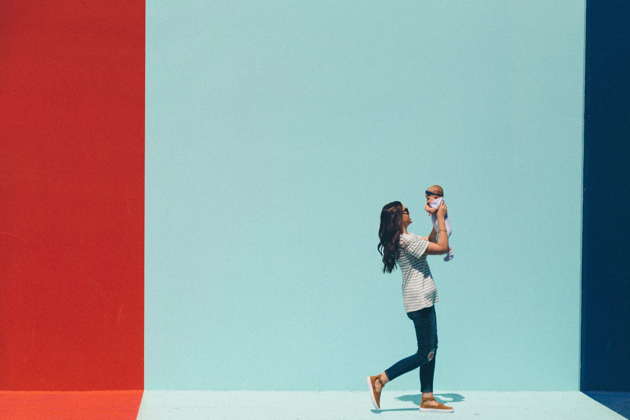 Stylish mum holding baby