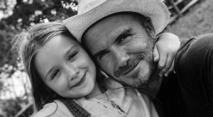 David Beckham with Harper smiling