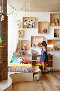 Little girl playing with toys in Oishi-m store