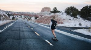 mental health in check mama disrupt Woman skateboaring down road