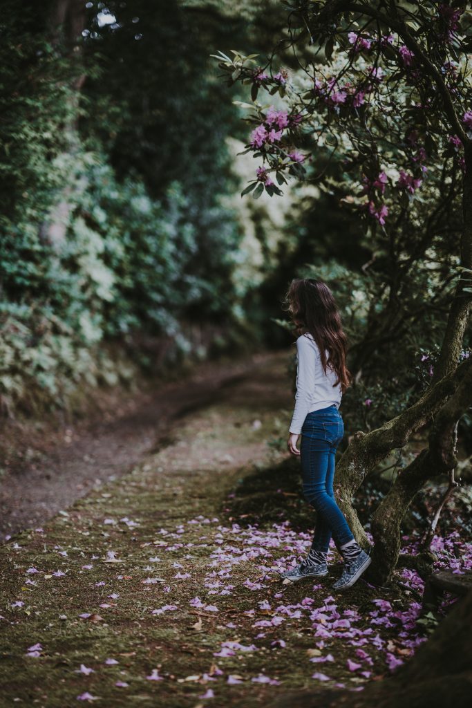 Young girl walking in garden