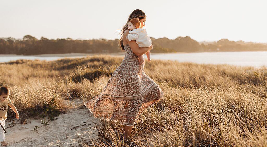 Carly McDonagh walking outside with baby