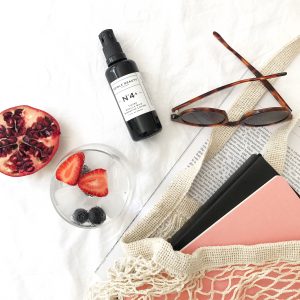 Edible Beauty Tinted vanilla silk flatly wth fruit bag and sunglasses