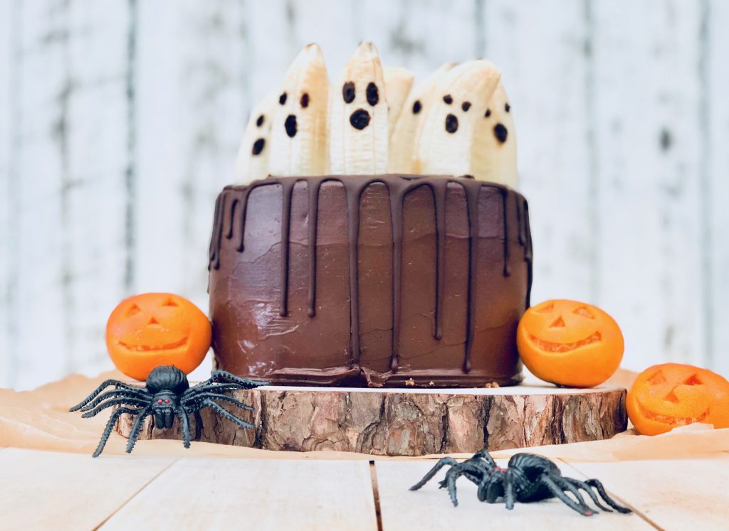 Halloween chocolate cake and ghost decorations