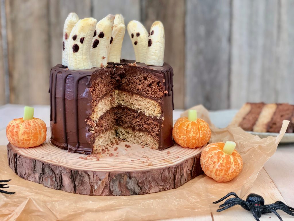 Halloween chocolate cake with marble inside and ghost decorations