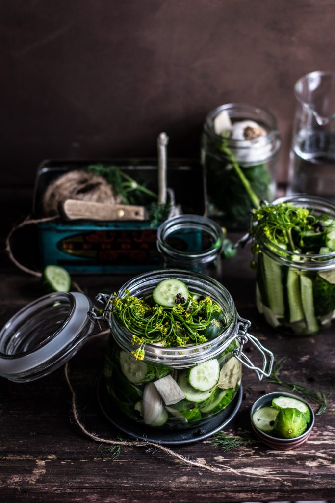 Green vegetables in glass jars