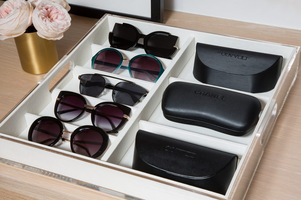 Sunglasses organised in wardrobe