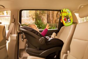 Baby in car seat with Brica by Munchkin mirror