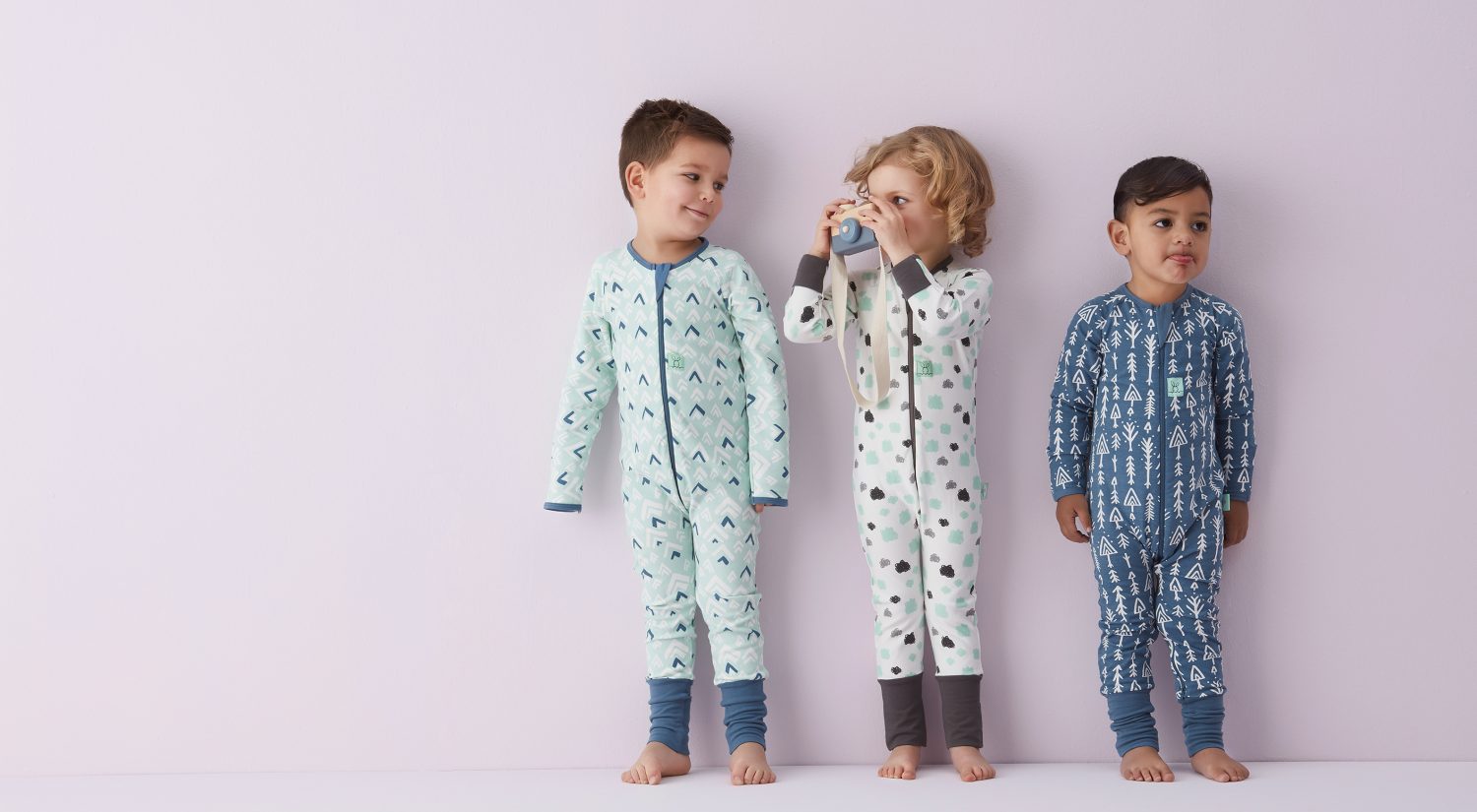 Three little kids standing in ergoPouch sleepwear