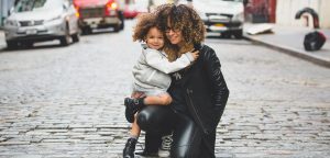 Trendy mum and daughter on road