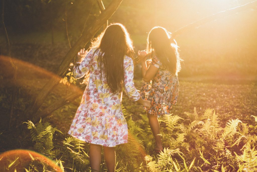 Two girls playing in garden
