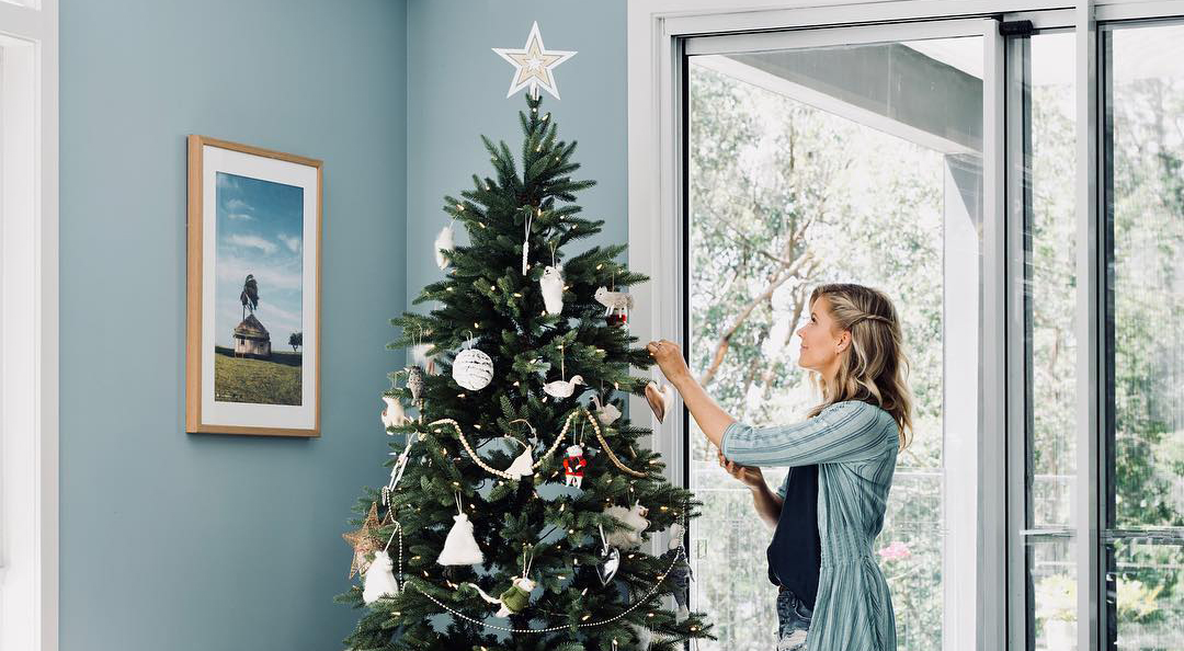 Carlene Duffy decorating her Christmas tree