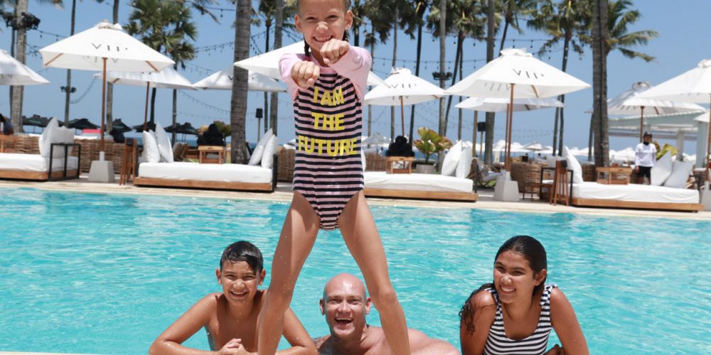 Miachel Klim with kids in swimming pool