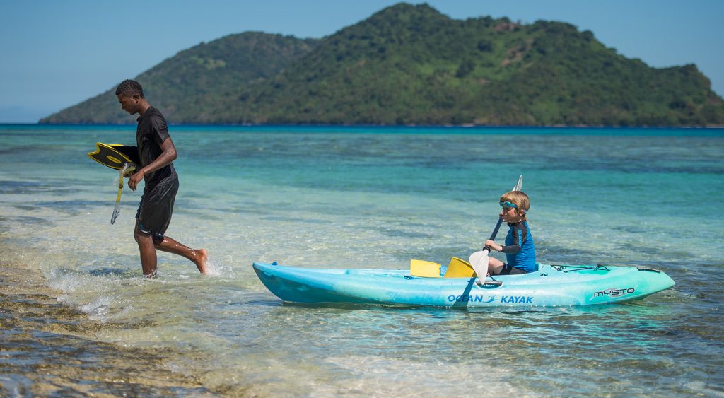 Nanuku child kayaking on private island