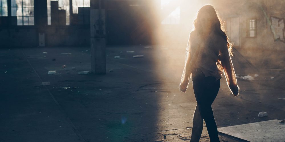 boost your confidence Woman walking with lovely light in background