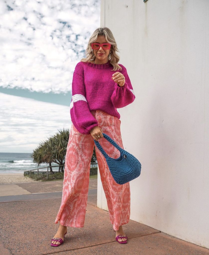 @catsanz wearing a pink jumper