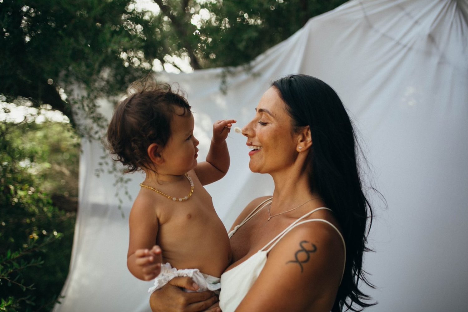 Leah Patara birth doula with baby