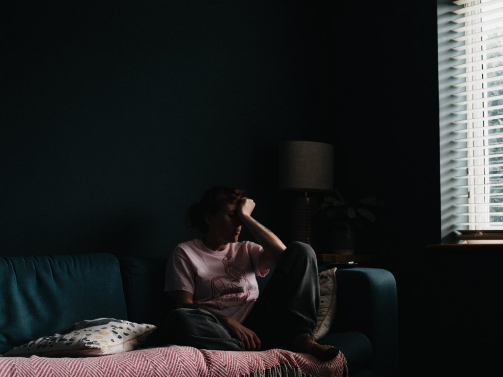 Postpartum psychosis woman on couch