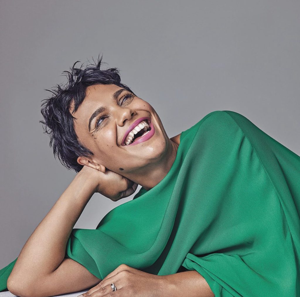 Miranda Tapsell laughing in a green top