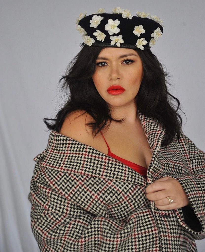 Nakkiah Lui wearing a floral hat
