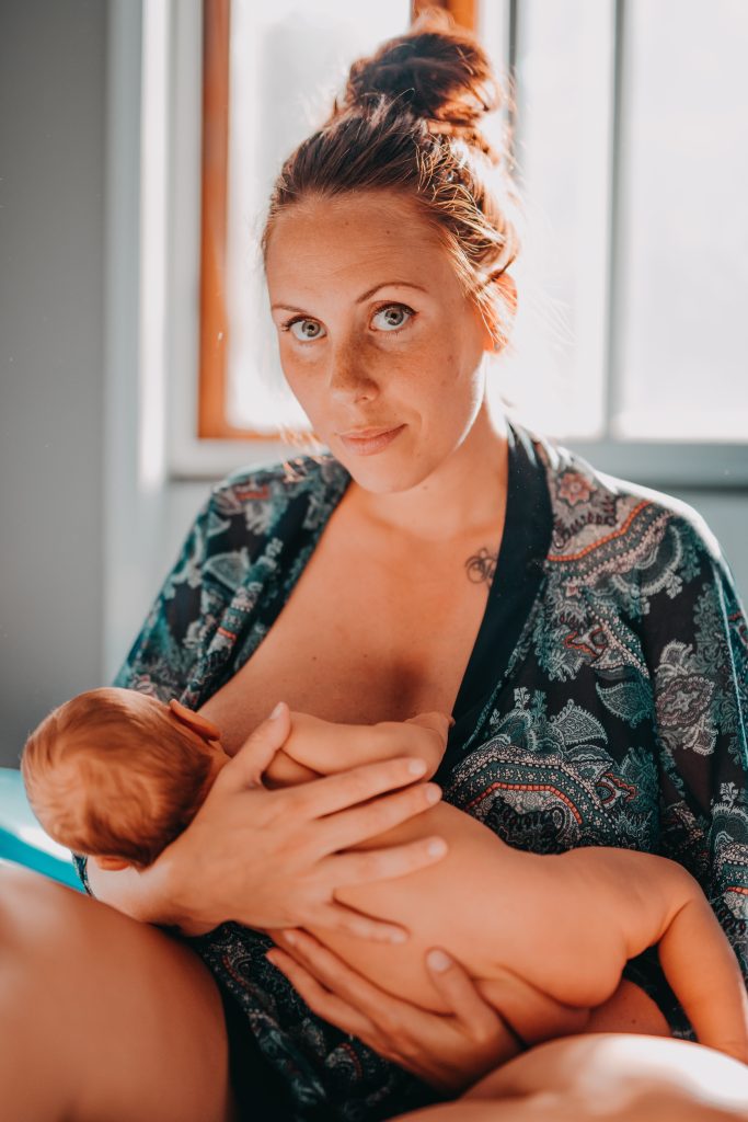 a mother breastfeeding her baby