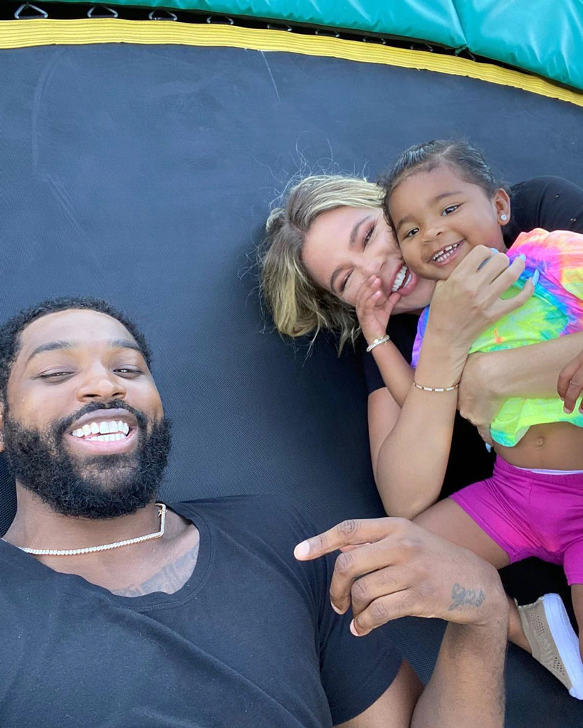 Khloe Kardashian on a trampoline with Tristan and True