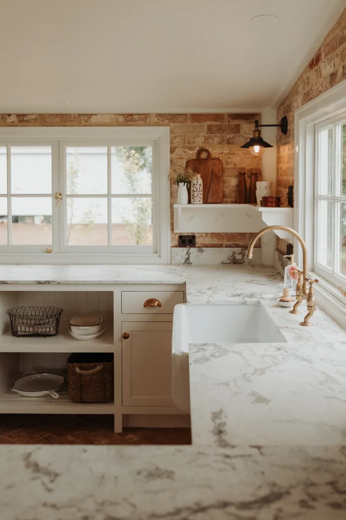 Bedside table with blush dahlias at The Gatehouse